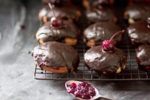 Bordeaux Cherry Filled Doughnuts with Dark Chocolate Glaze