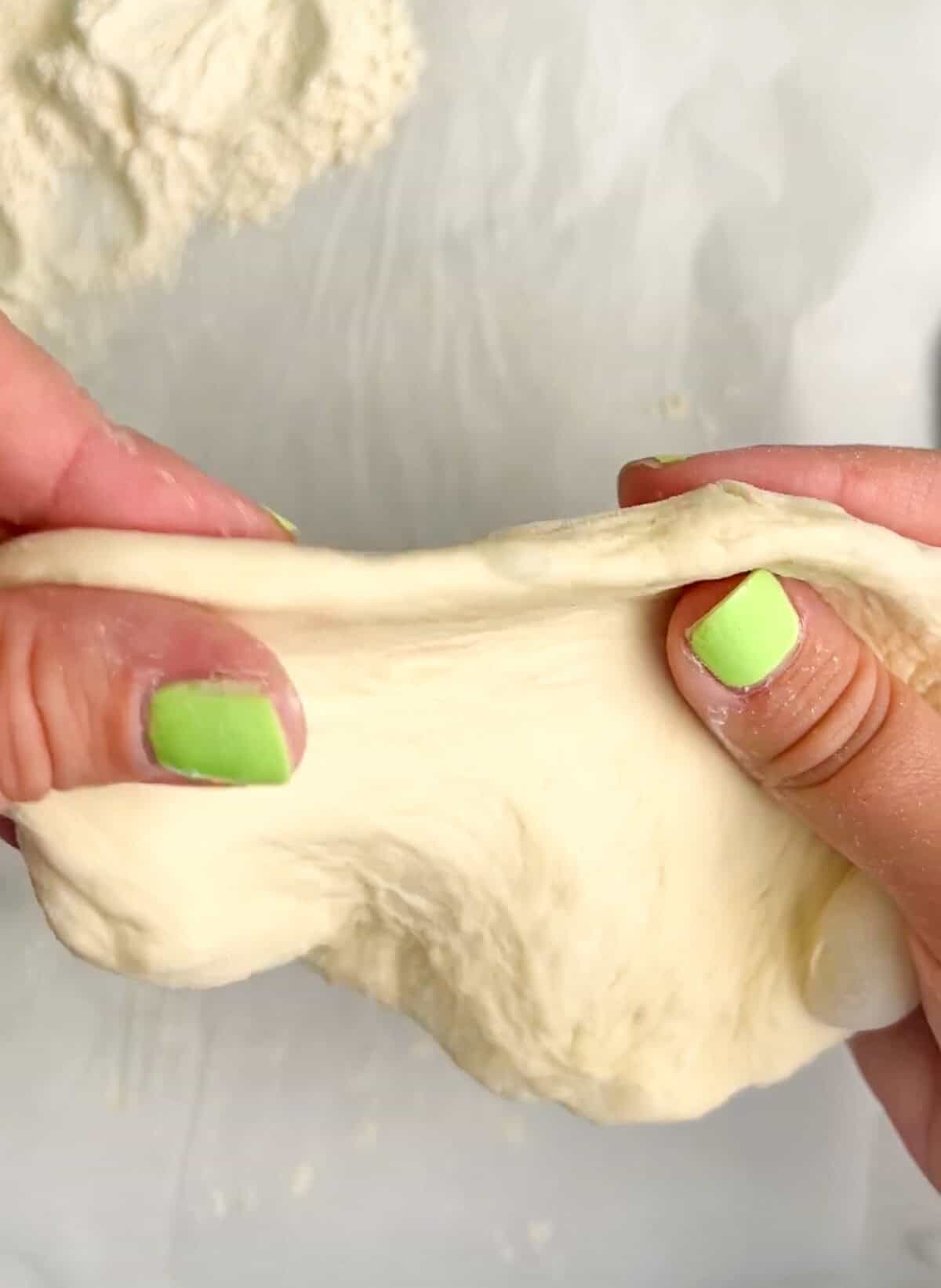 Pockets of dough are stuffed with your favorite pizza toppings, sauce, and cheese in these super easy Air Fryer Calzones. Stretching a ball of pizza dough