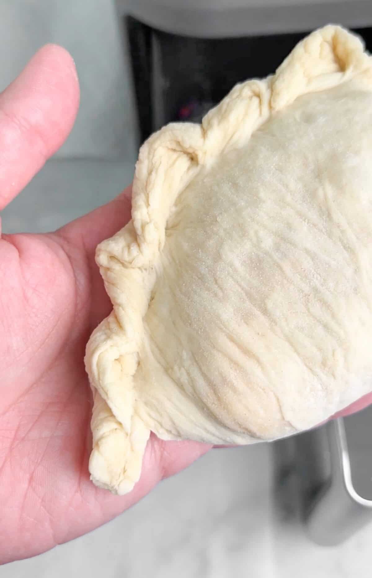 Pockets of dough are stuffed with your favorite pizza toppings, sauce, and cheese in these super easy Air Fryer Calzones. Air Fryer Calzones