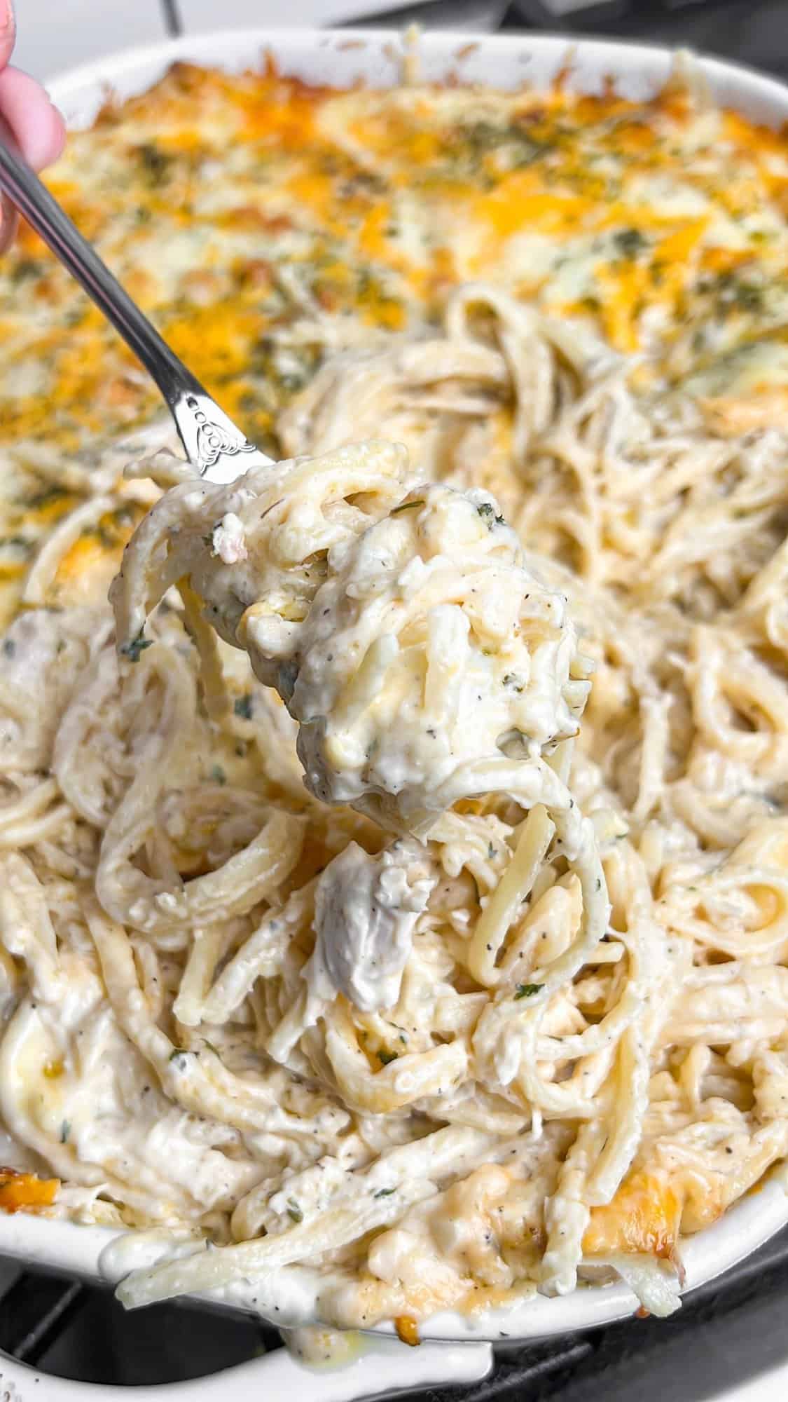 Lusciously creamy, cheesy, and garlicky, this easy chicken tetrazzini can be whipped up in under an hour for an easy weeknight dinner. A forkful of chicken tetrazzini