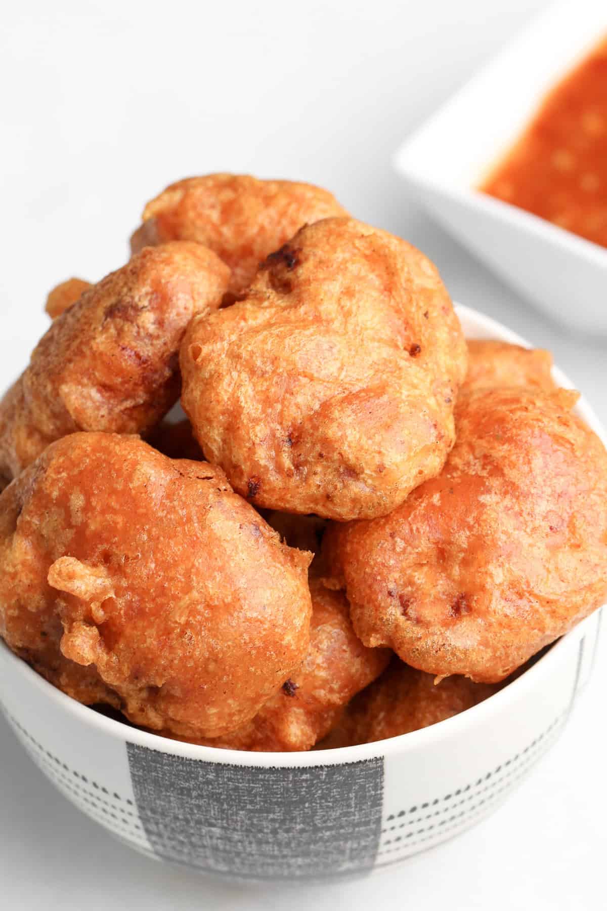 A spicy version of McDonald's Chicken Nugget recipe and Mighty Hot Sauce. These spicy chicken nuggets are super crispy, juicy and addictive. Overhead view of a bowl of spicy chicken nuggets