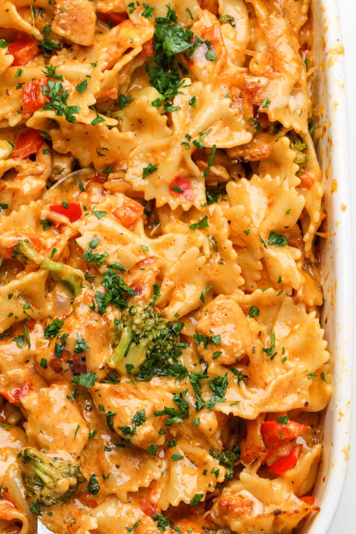 Inspired by the Cheesecake Factory, this Louisiana Chicken Pasta Bake is a cajun alfredo chicken pasta with veggies smothered in cheese. Overhead view of Louisiana chicken pasta in a baking dish
