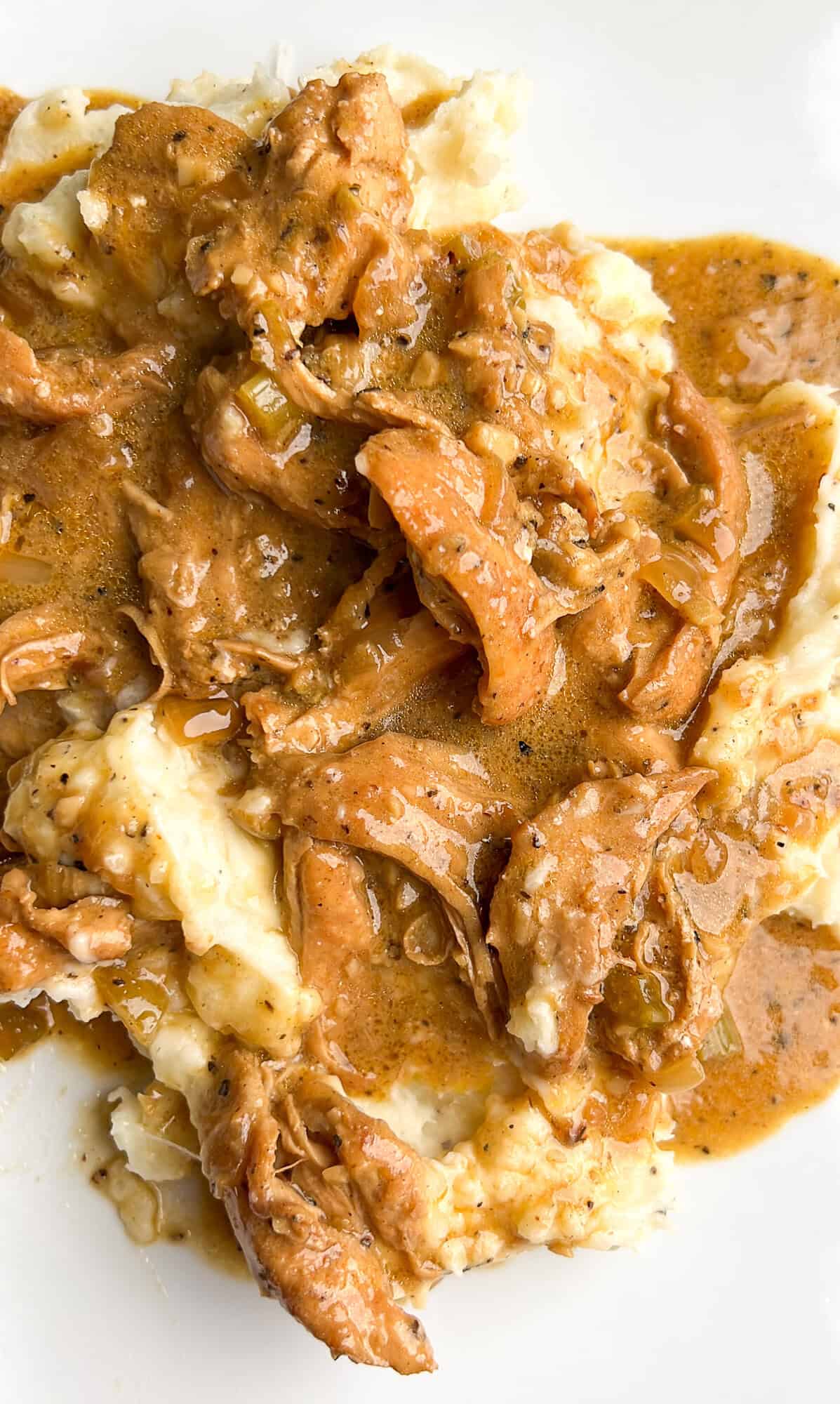 With tender chicken cooked in homemade pan gravy, Smothered Chicken and Gravy is classic Southern comfort food. Ready in 30 minutes! A plate of smothered chicken and gravy over mashed potatoes