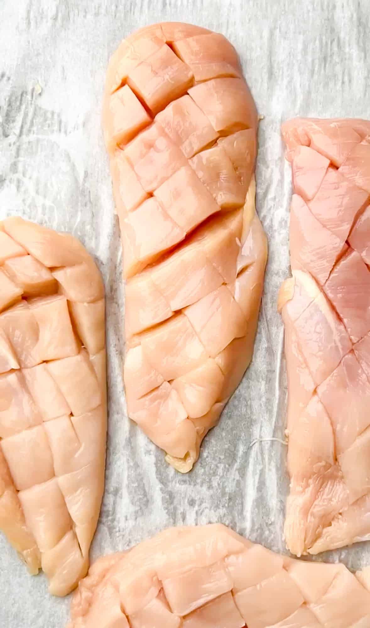 Equal parts sweet and spicy, this Honey Chipotle Chicken is a quick, easy one-pan recipe that results in juicy, flavorful chicken every time. Chicken breasts sliced with a criss-cross pattern