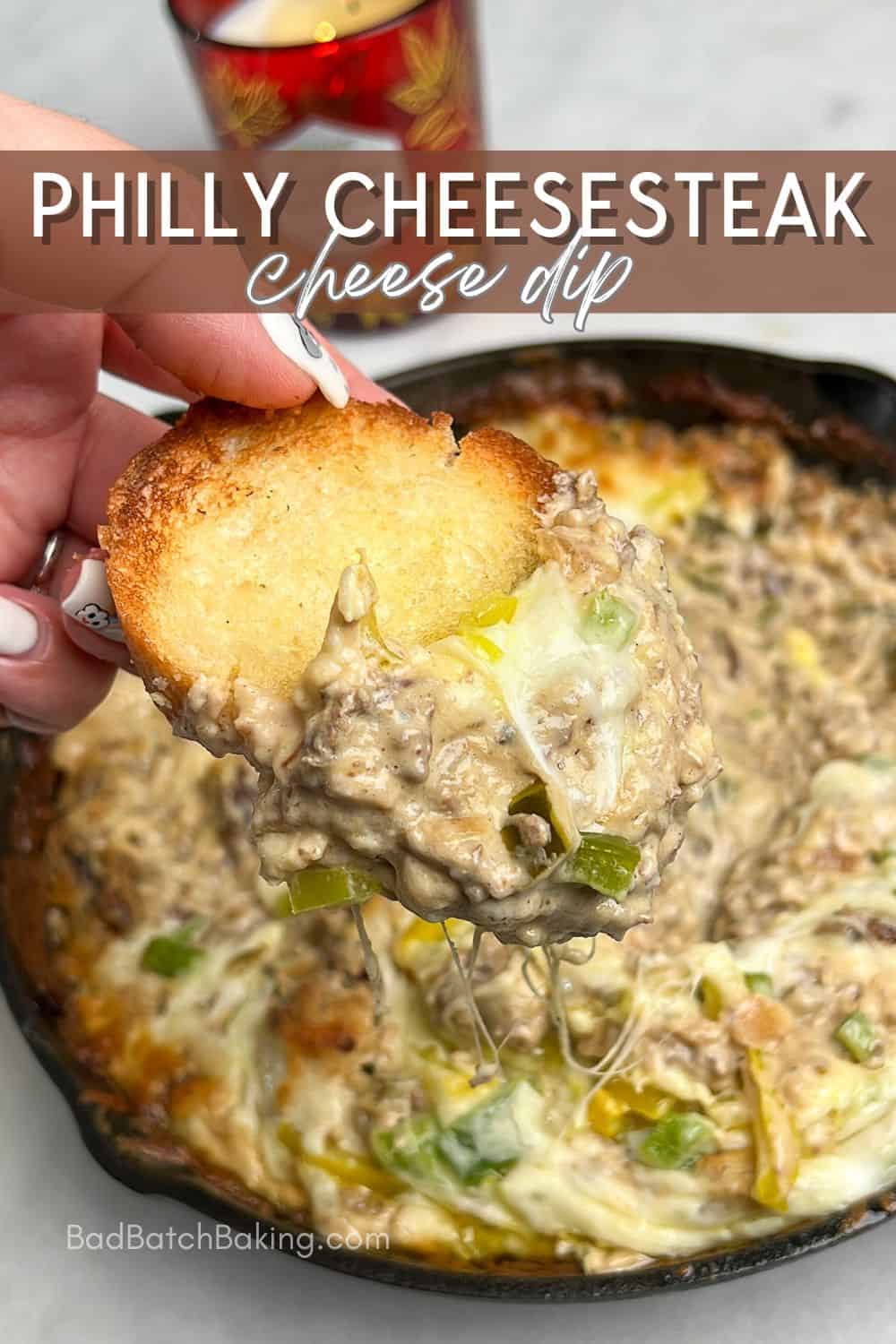 steak cheese dip in a cast iron skillet