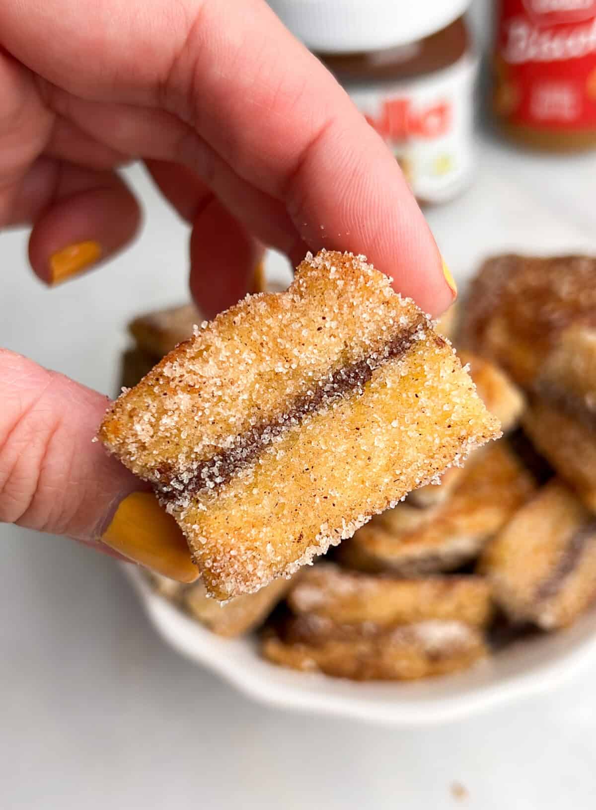 mini stuffed french toast bites in hand