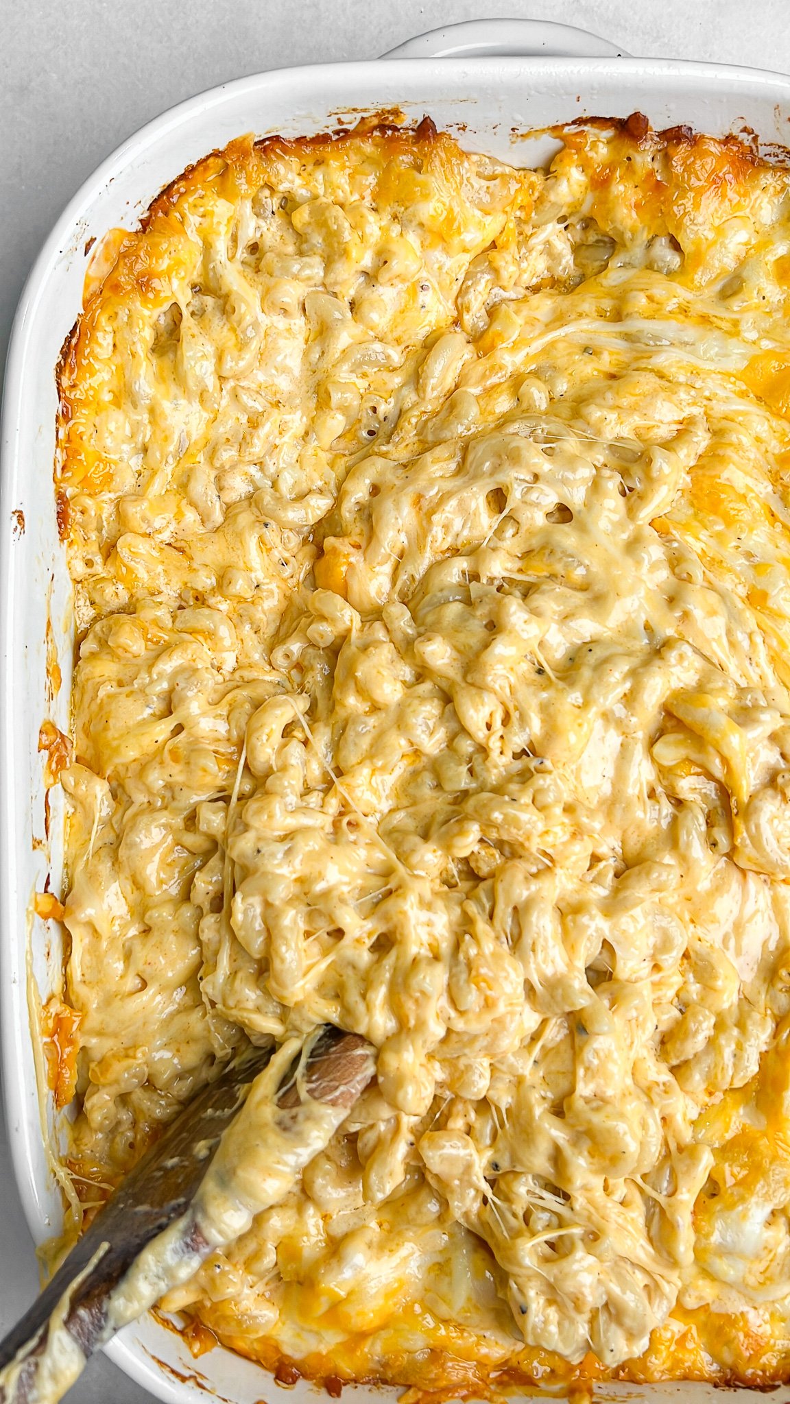 gooey macaroni and cheese freshly baked in a pan