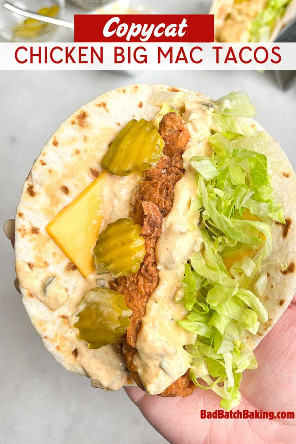 a fried chicken taco with sauce, lettuce and pickles