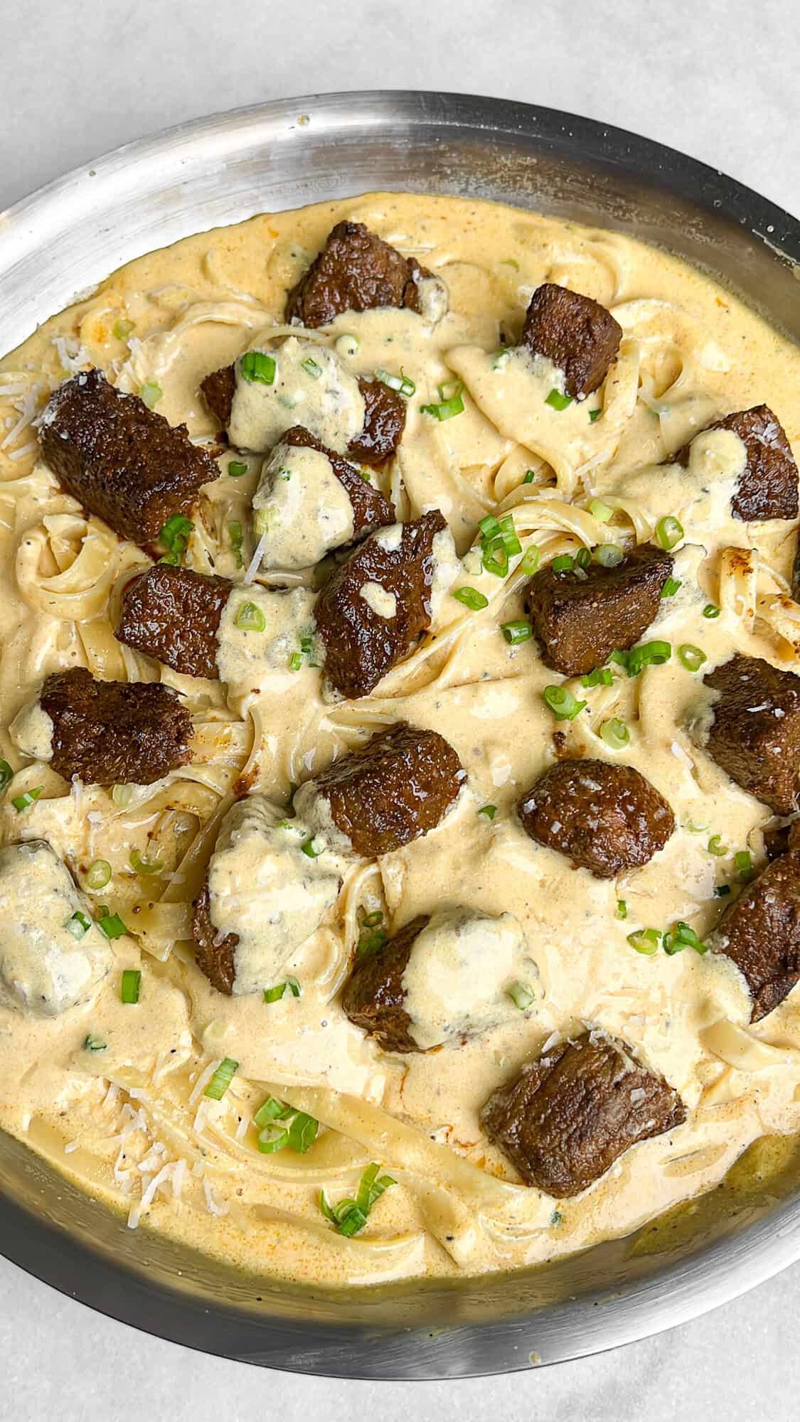 steak topped fettuccini alfredo