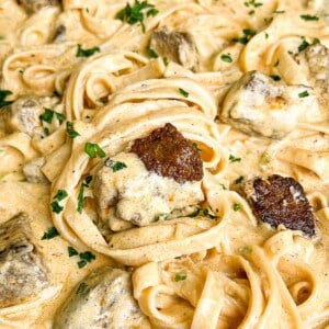 creamy steak fettuccini alfredo in a pan