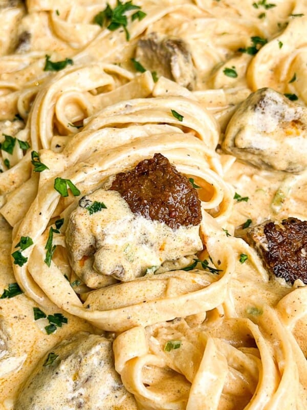 creamy steak fettuccini alfredo in a pan