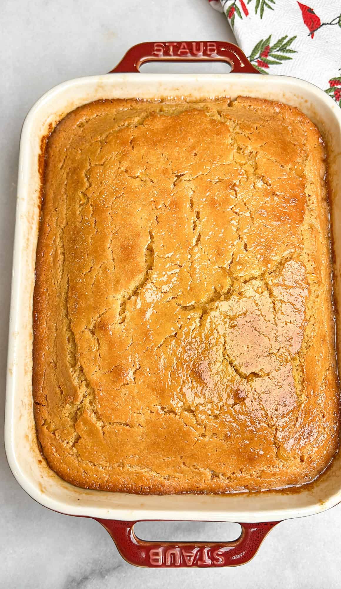 a pan of fresh baked cornbread brushed with honey butter