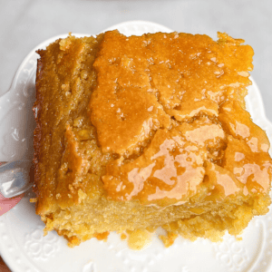 a slice of honey butter cornbread on a plate