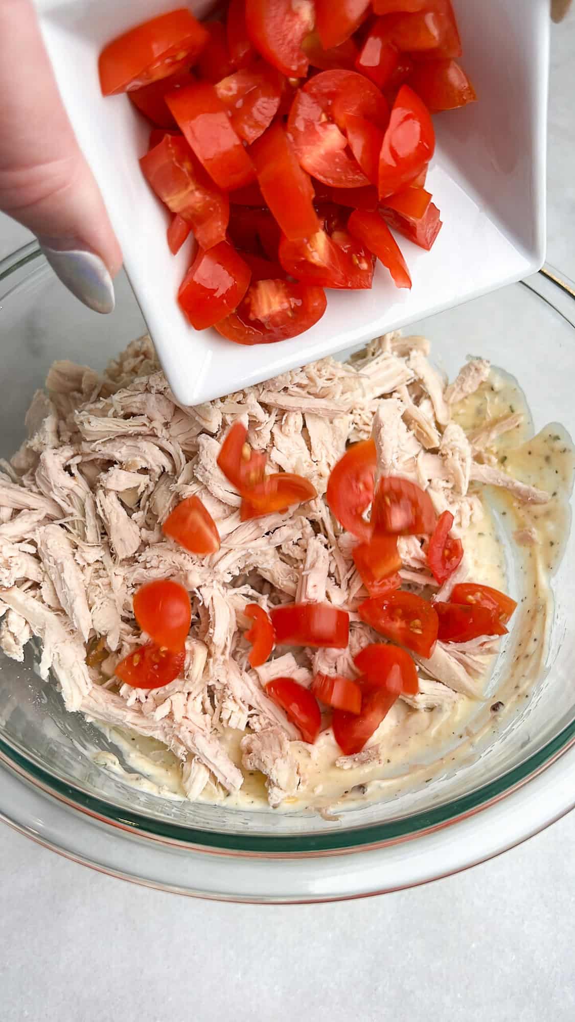 pouring in the diced tomatoes