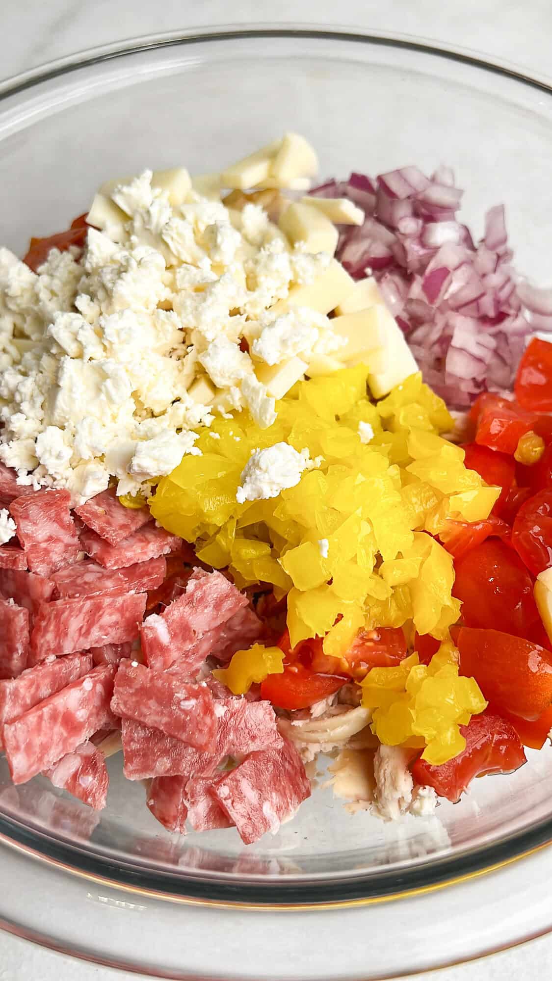 italian grinder chicken salad toppings in a bowl