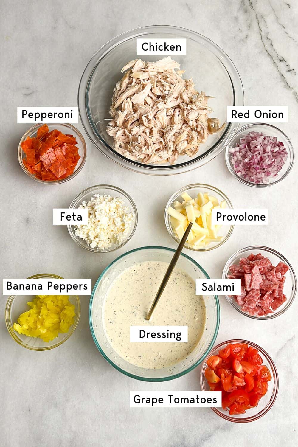 all of the measured ingredients for the grinder chicken salad