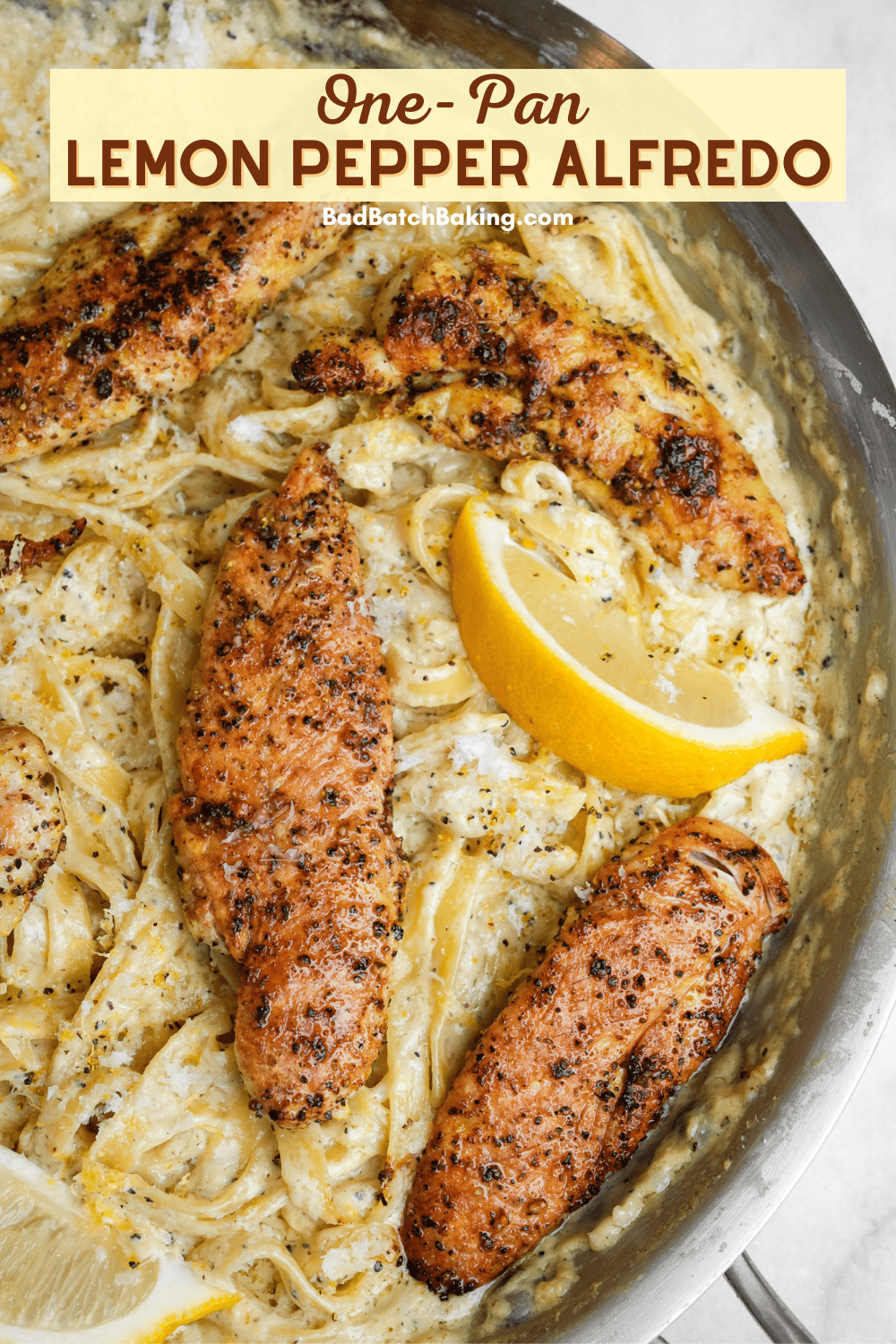 lemon pepper chicken on fettuccine alfredo in a pan