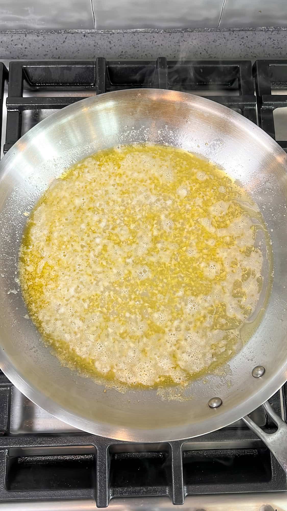 garlic butter and wine deglazing in the pan