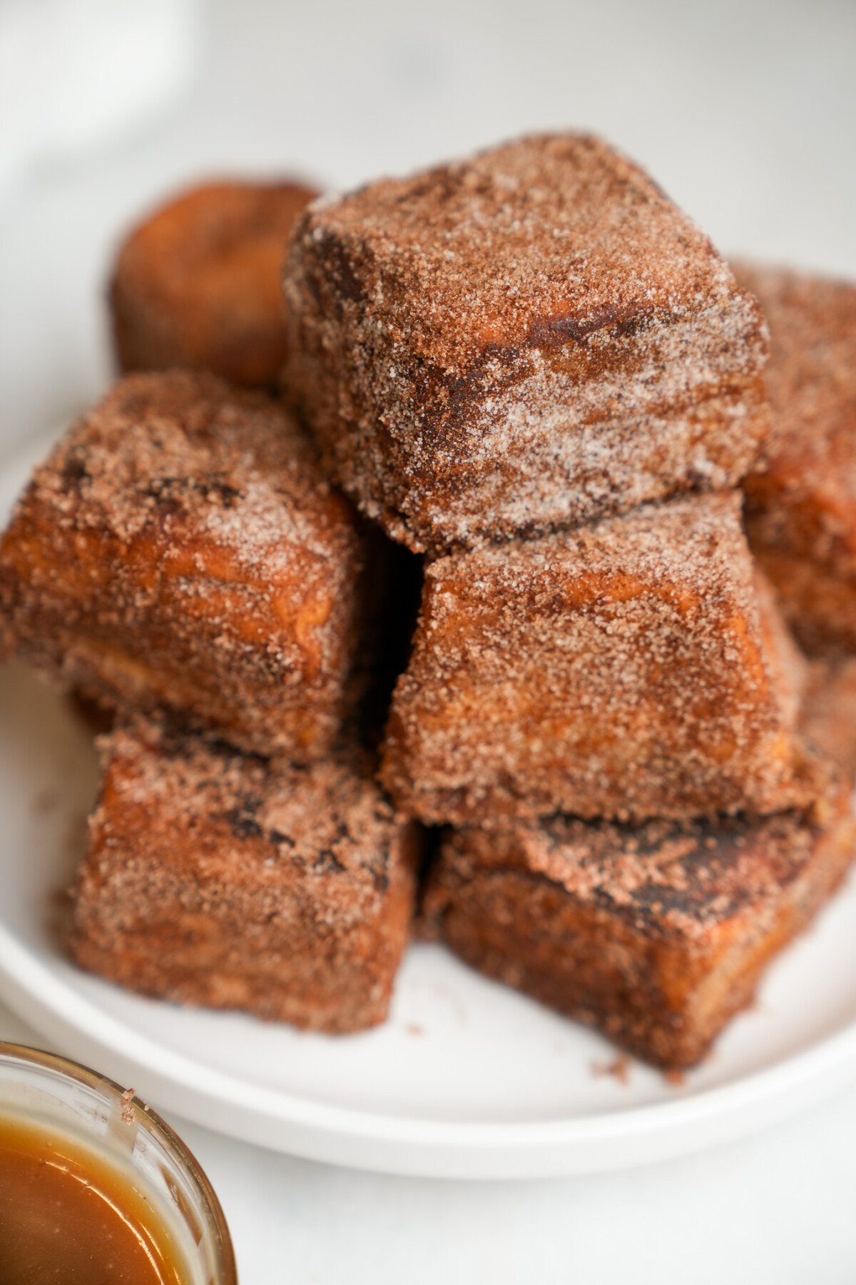 french toast rolls piled on a plate