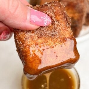 french toast dipping into caramel sauce