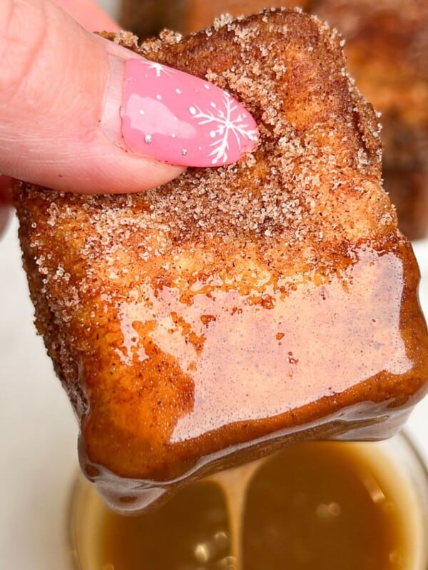 french toast dipping into caramel sauce