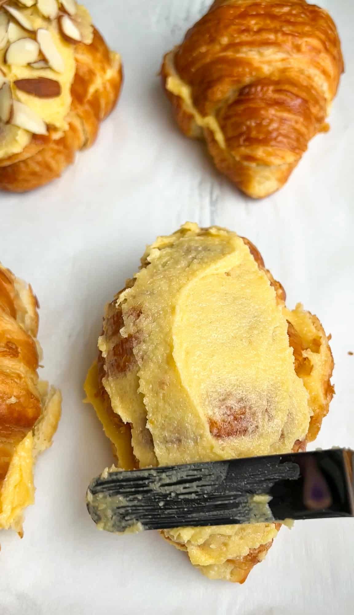 spreading filling on top of the croissants