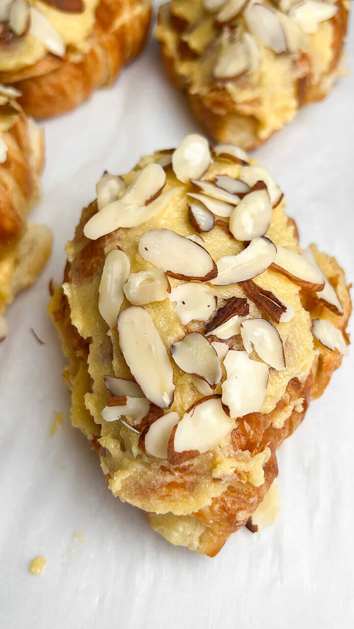 add almonds to the top of the croissants