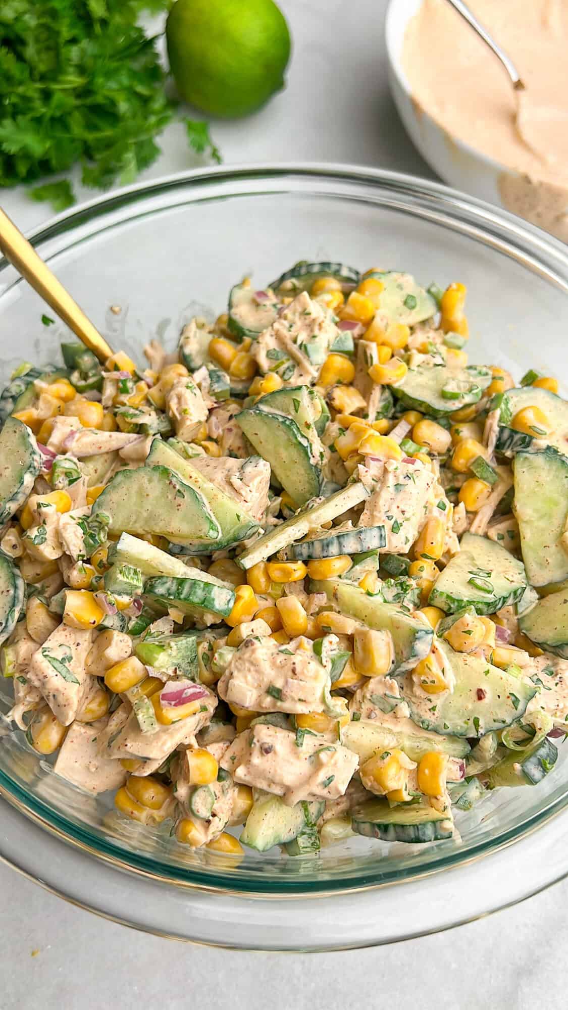 street corn creamy cucumber salad in a large bowl