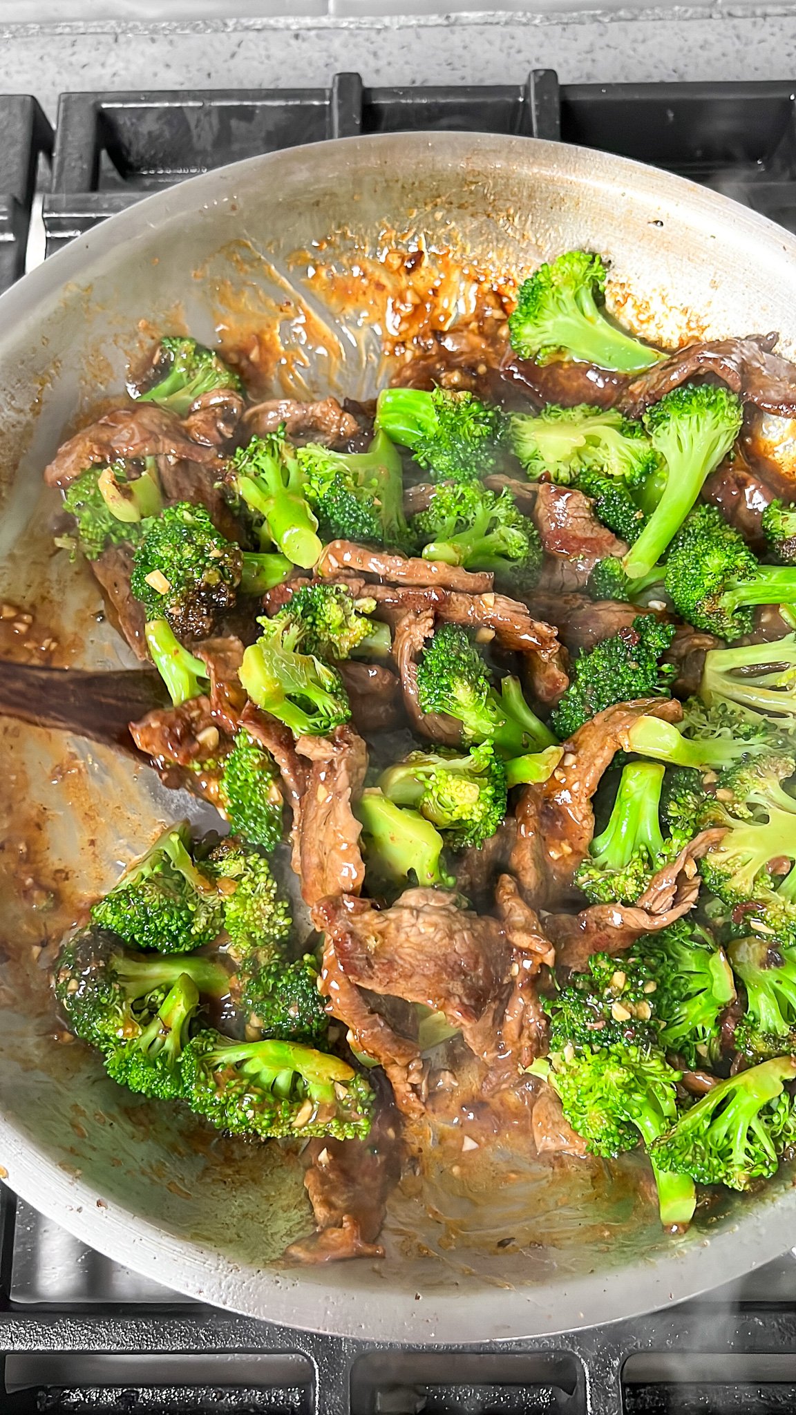 beef and broccoli finishing in the pan