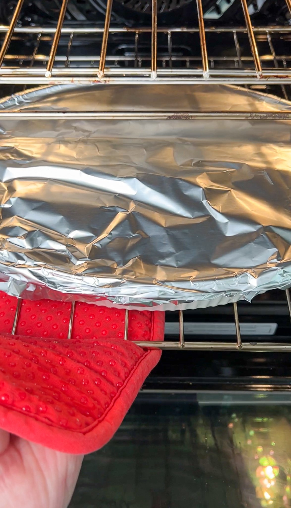 chicken tzatziki casserole covered with foil going in oven