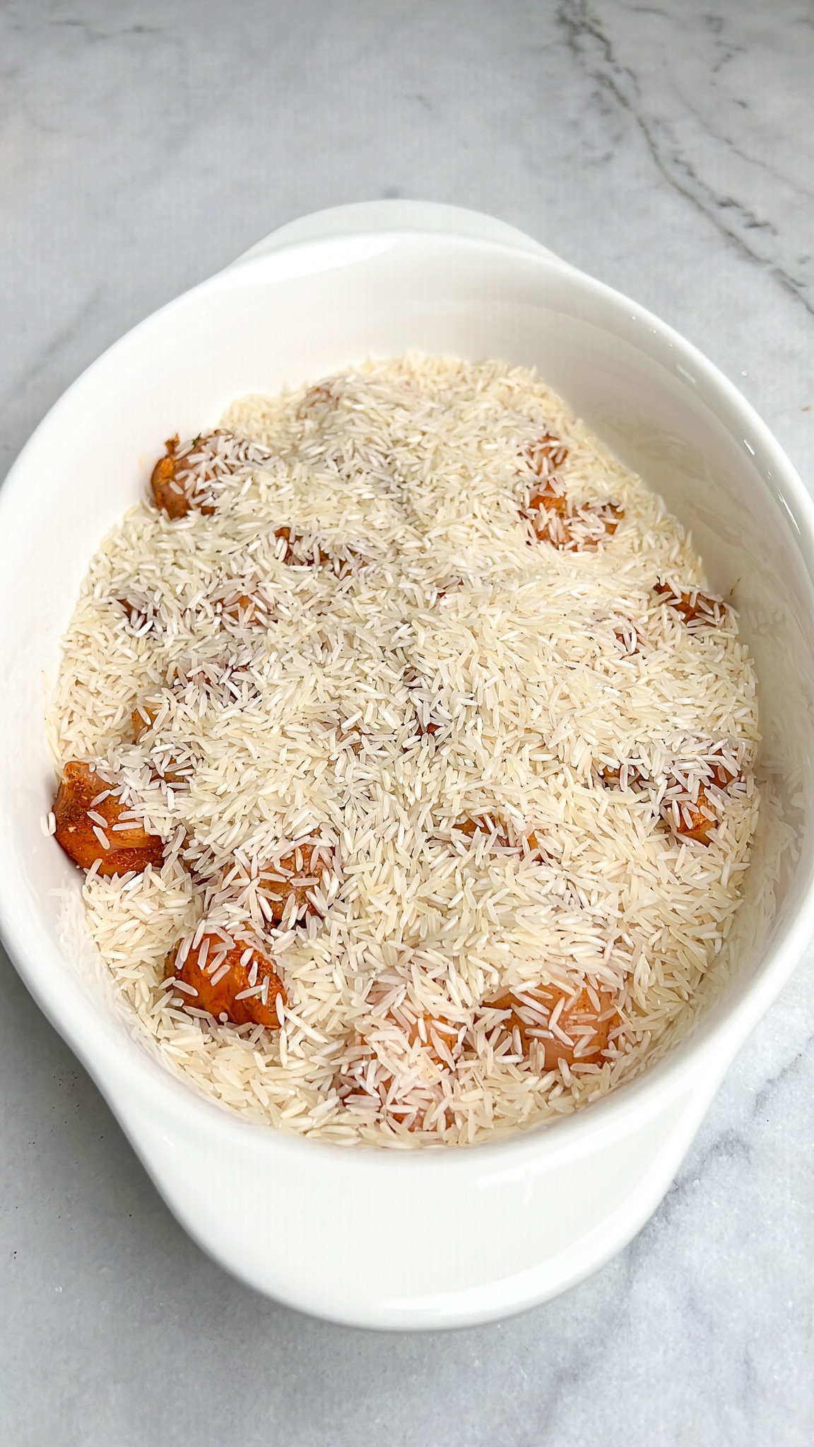 rice added to the casserole dish