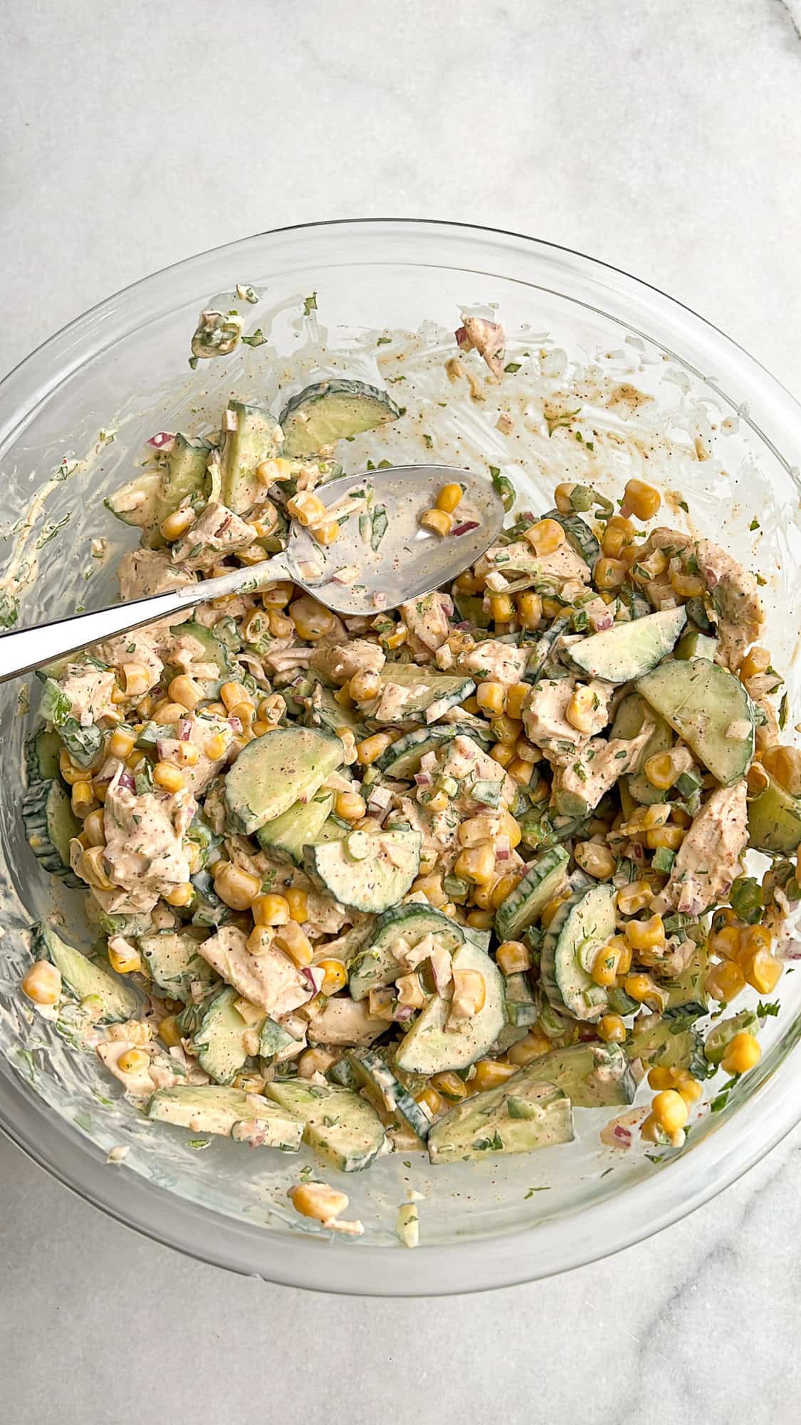 cucumber salad mixed together in a bowl