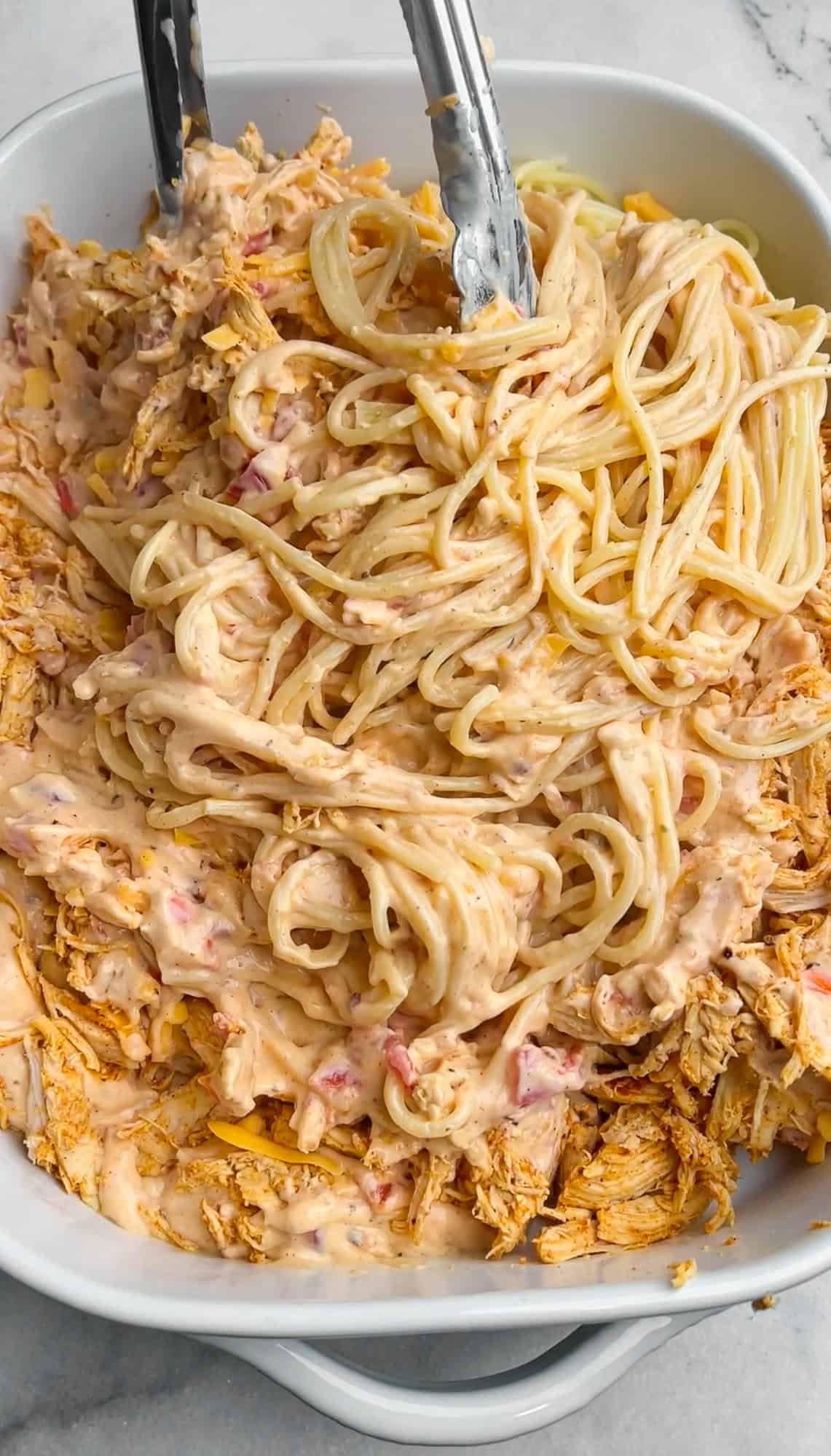 tossing the ingredients together in a casserole dish