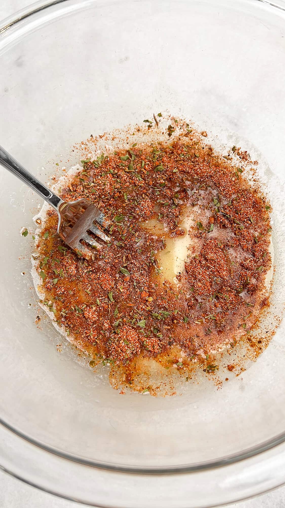 butter and cajun seasoning mixing together