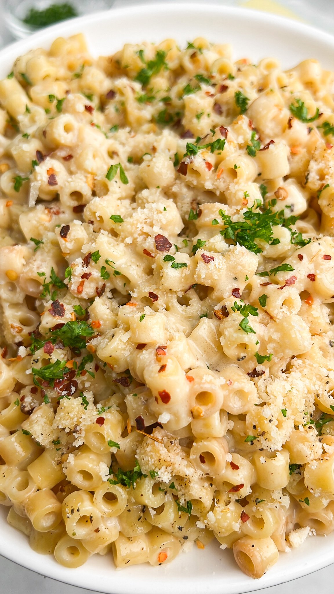 pasta on a plate topped with parsley