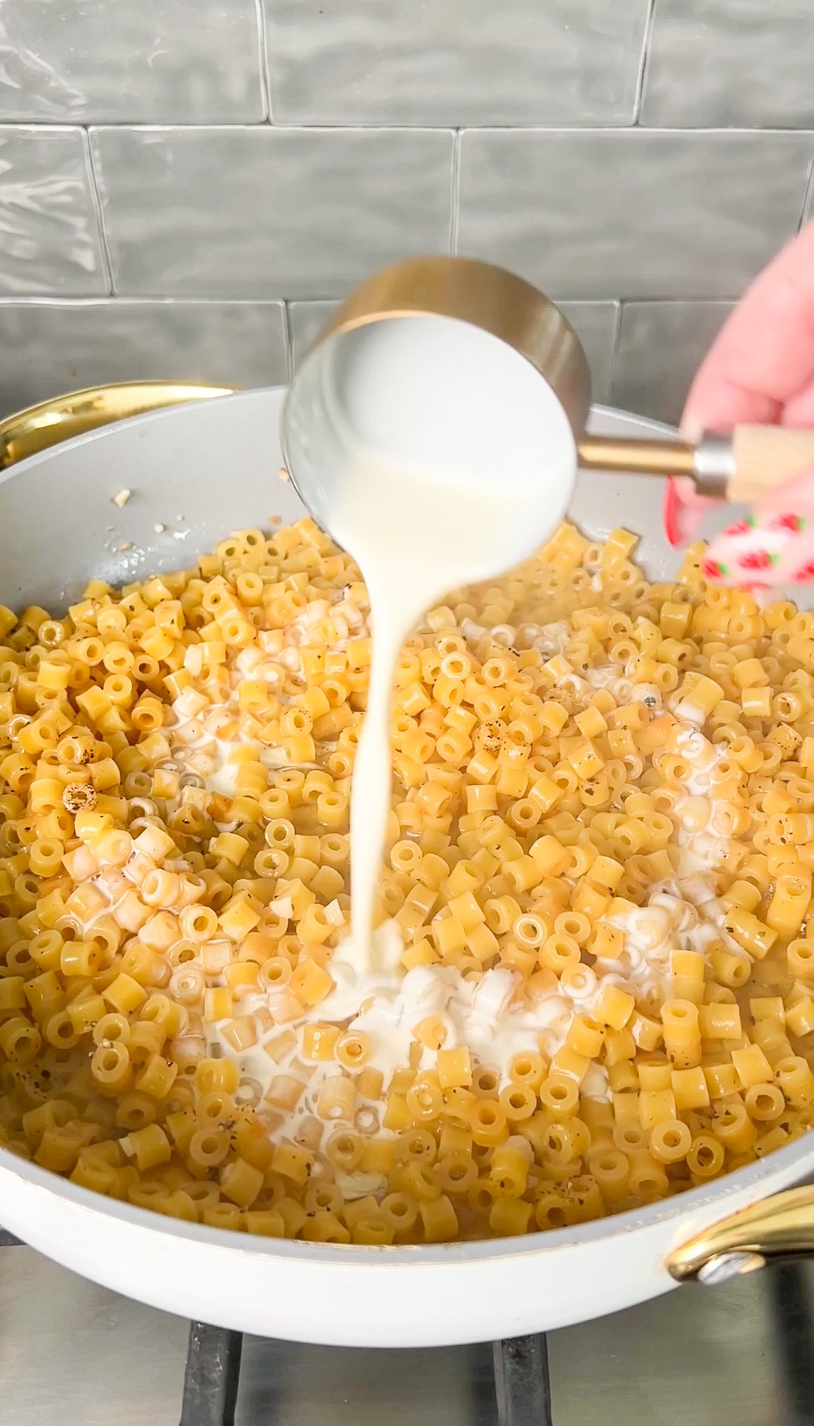 cream pouring into the pan