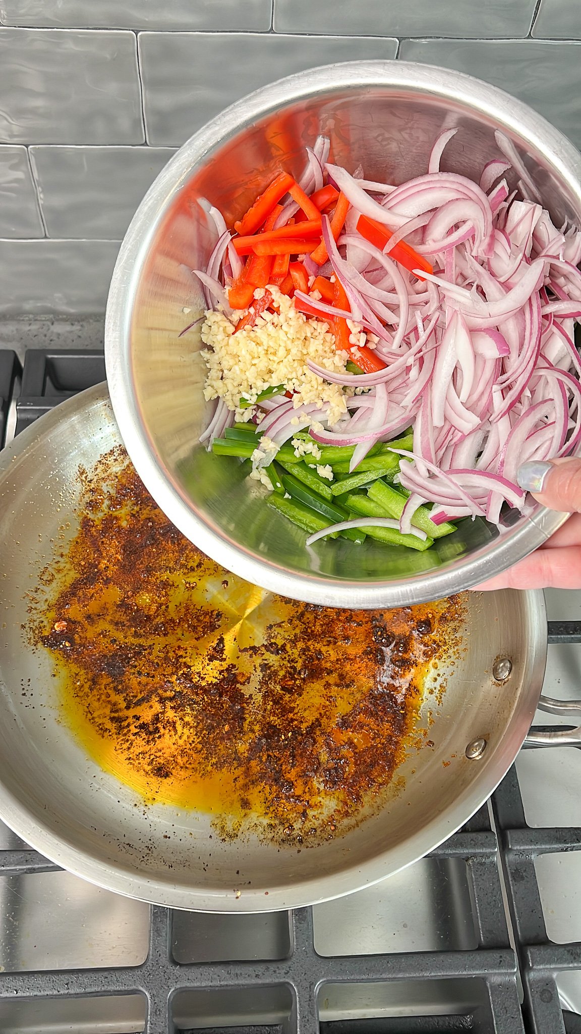 sliced veggies being added to the skillet