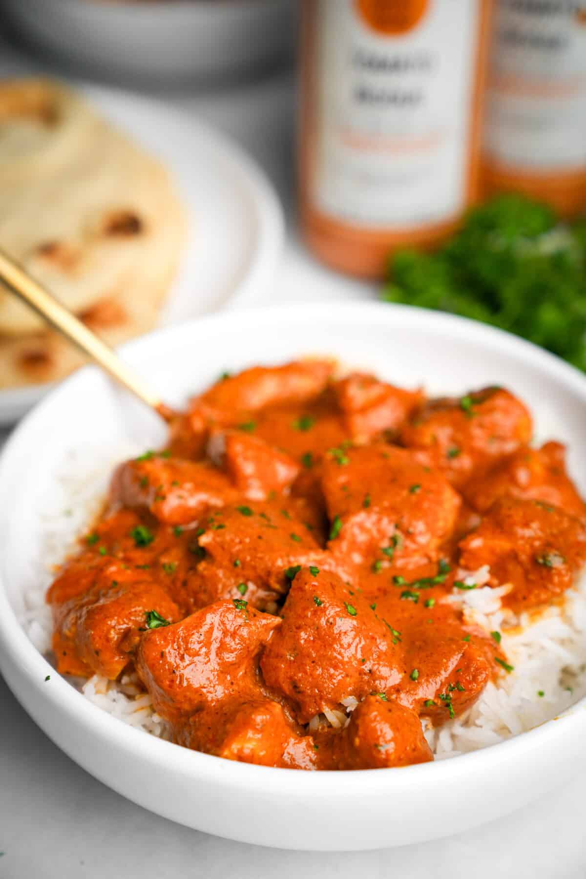 butter chicken in a bowl over rice