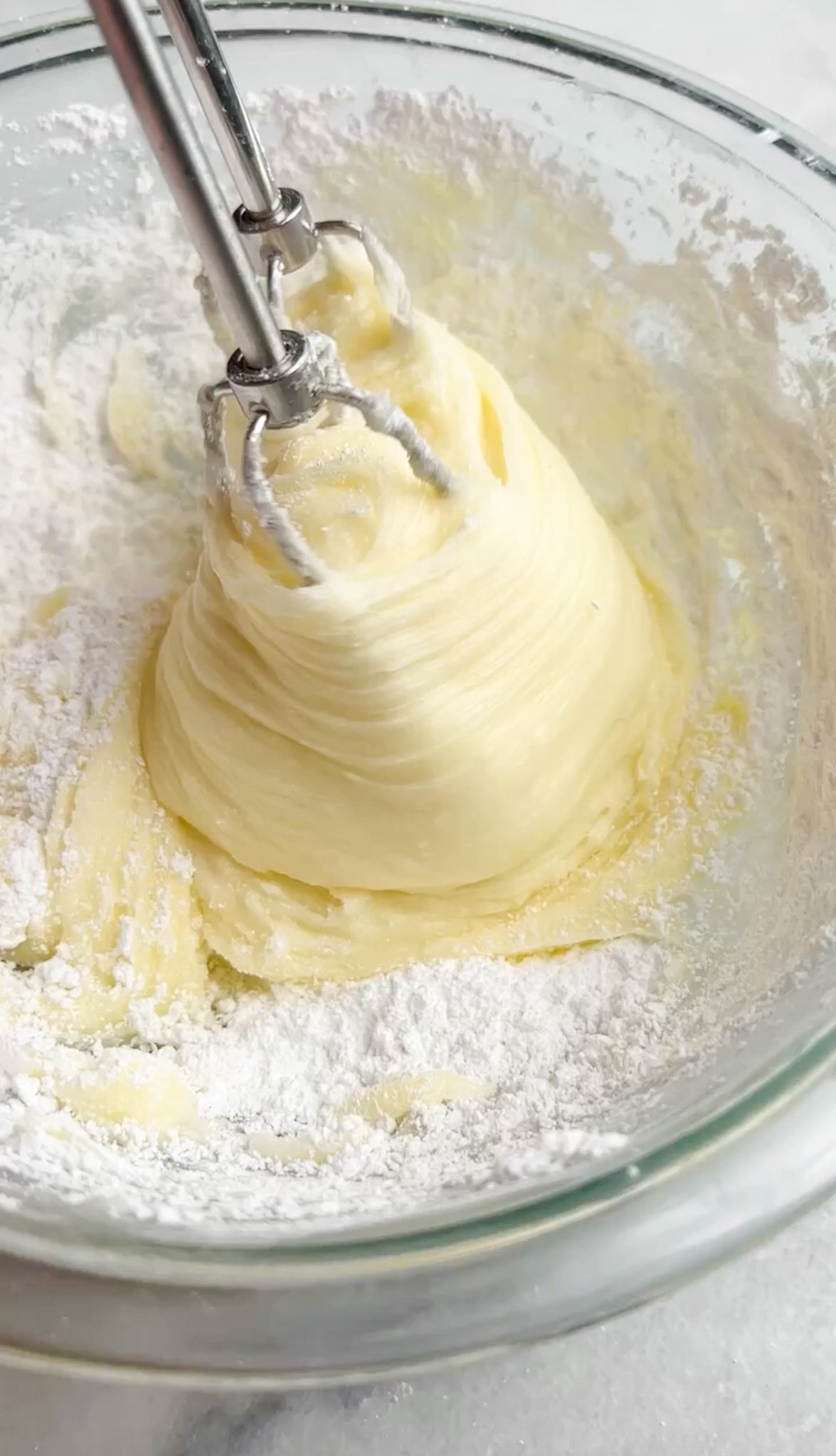 cheesecake filling being whipped by hand