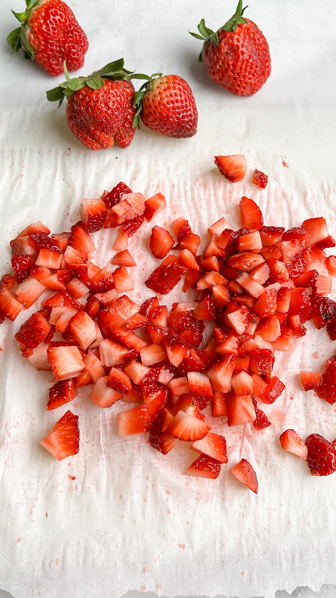 diced strawberries on a cutting board