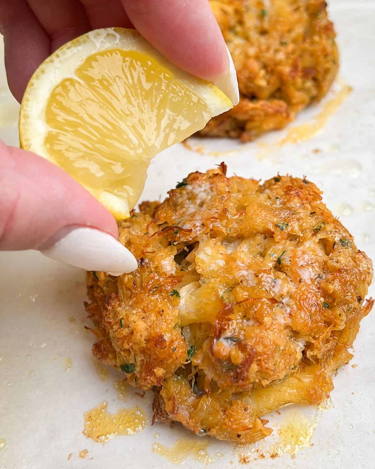 crab cakes fresh baked with lemon wedges