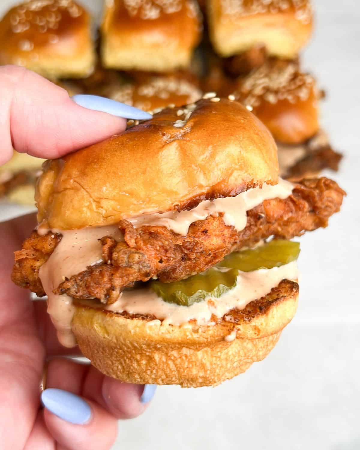 fried chicken slider being held in hand
