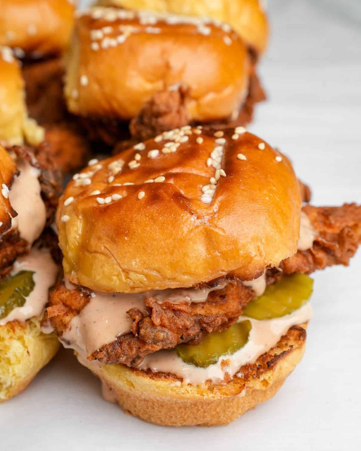 fried chicken sliders with pickles and creamy sauce