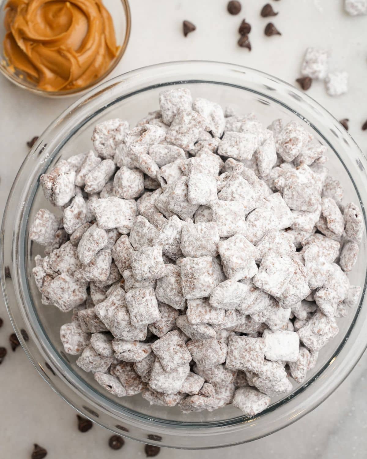 muddy buddies snack in a large bowl on the counter