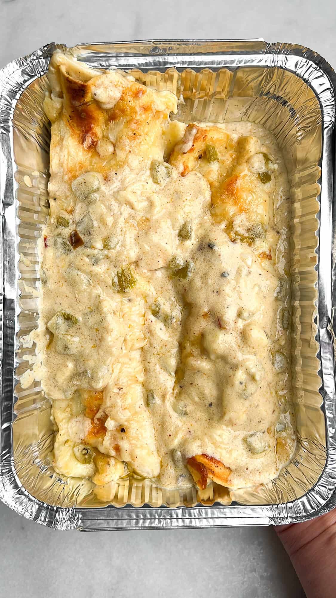 freezer-friendly enchiladas in a foil container