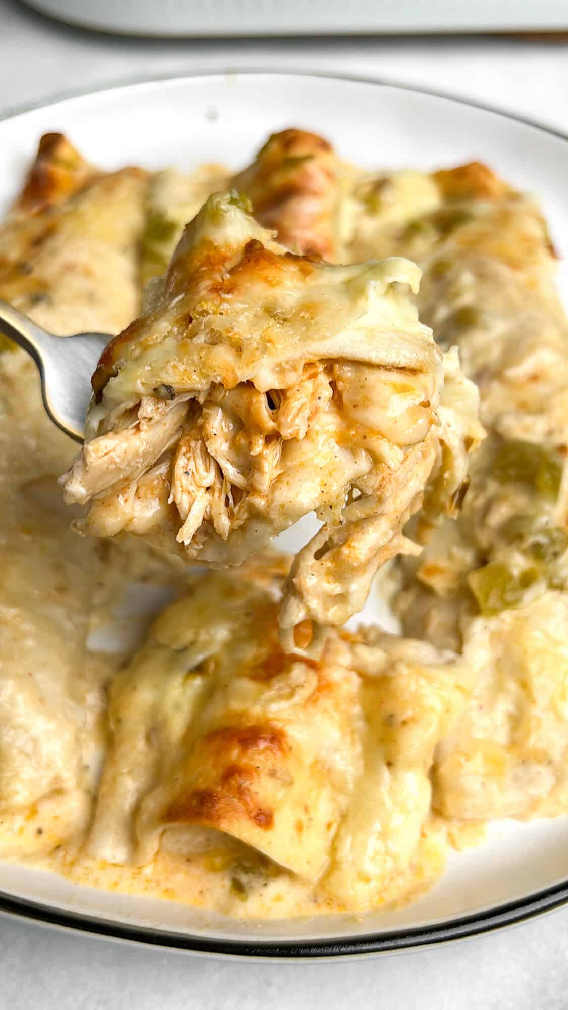 green chile chicken enchiladas on a plate