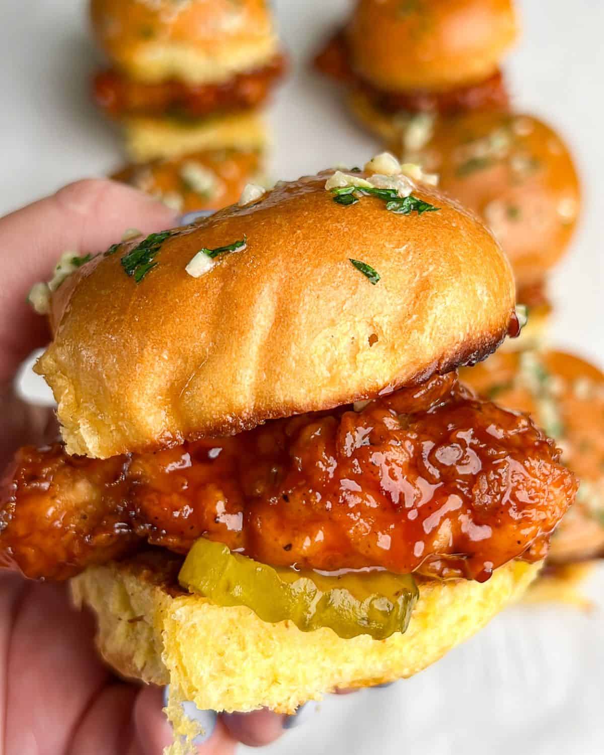 chicken sliders being held in hand
