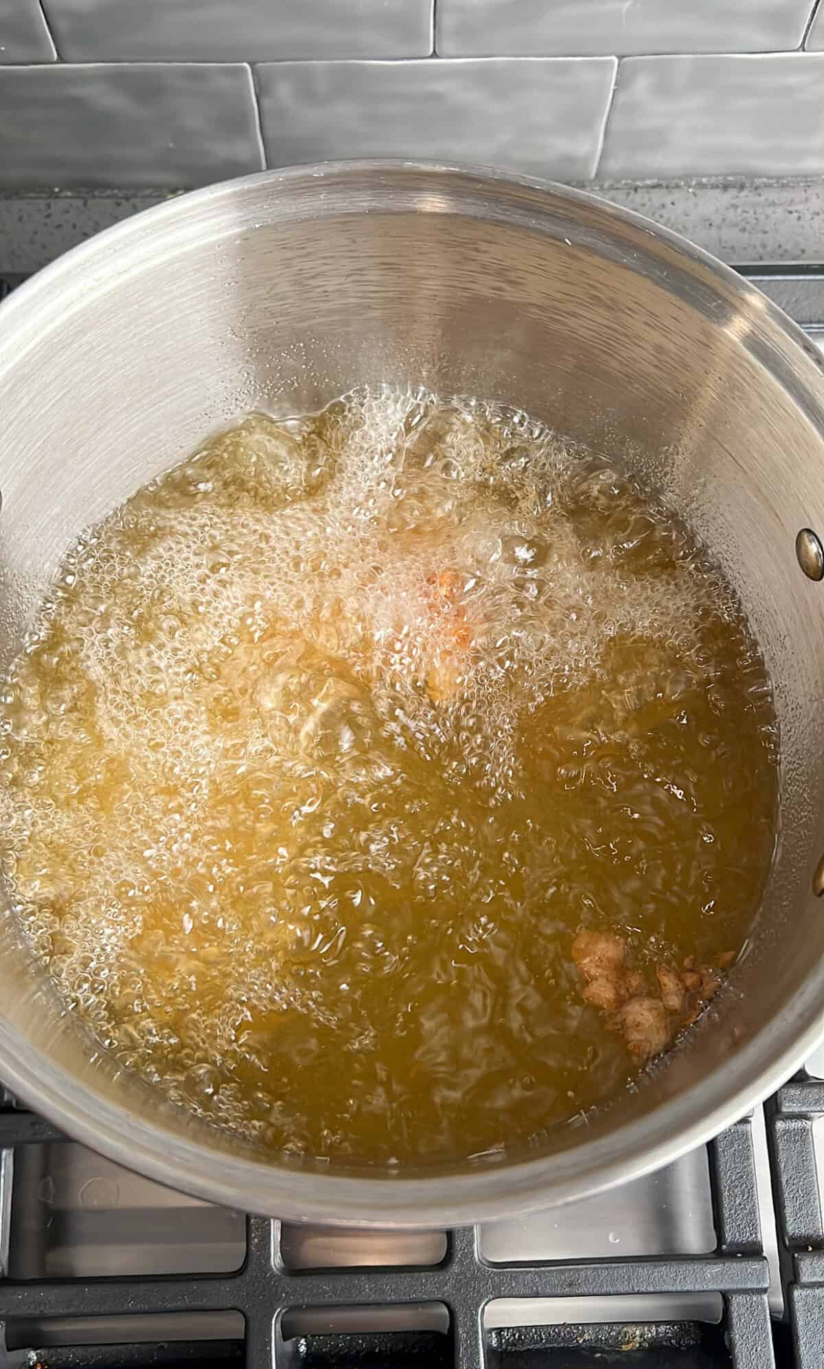frying chicken in hot oil