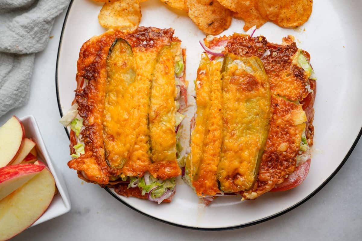 pickle sandwich sitting on a plate