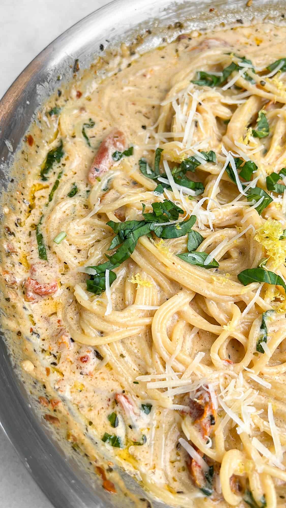 one-pot pasta with basil and lemon sitting on a counter